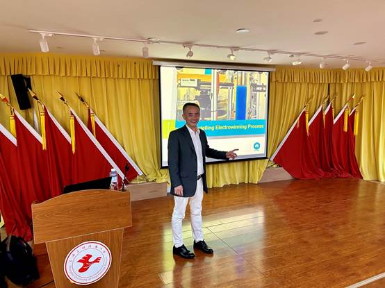 A person standing in front of a podium

Description automatically generated